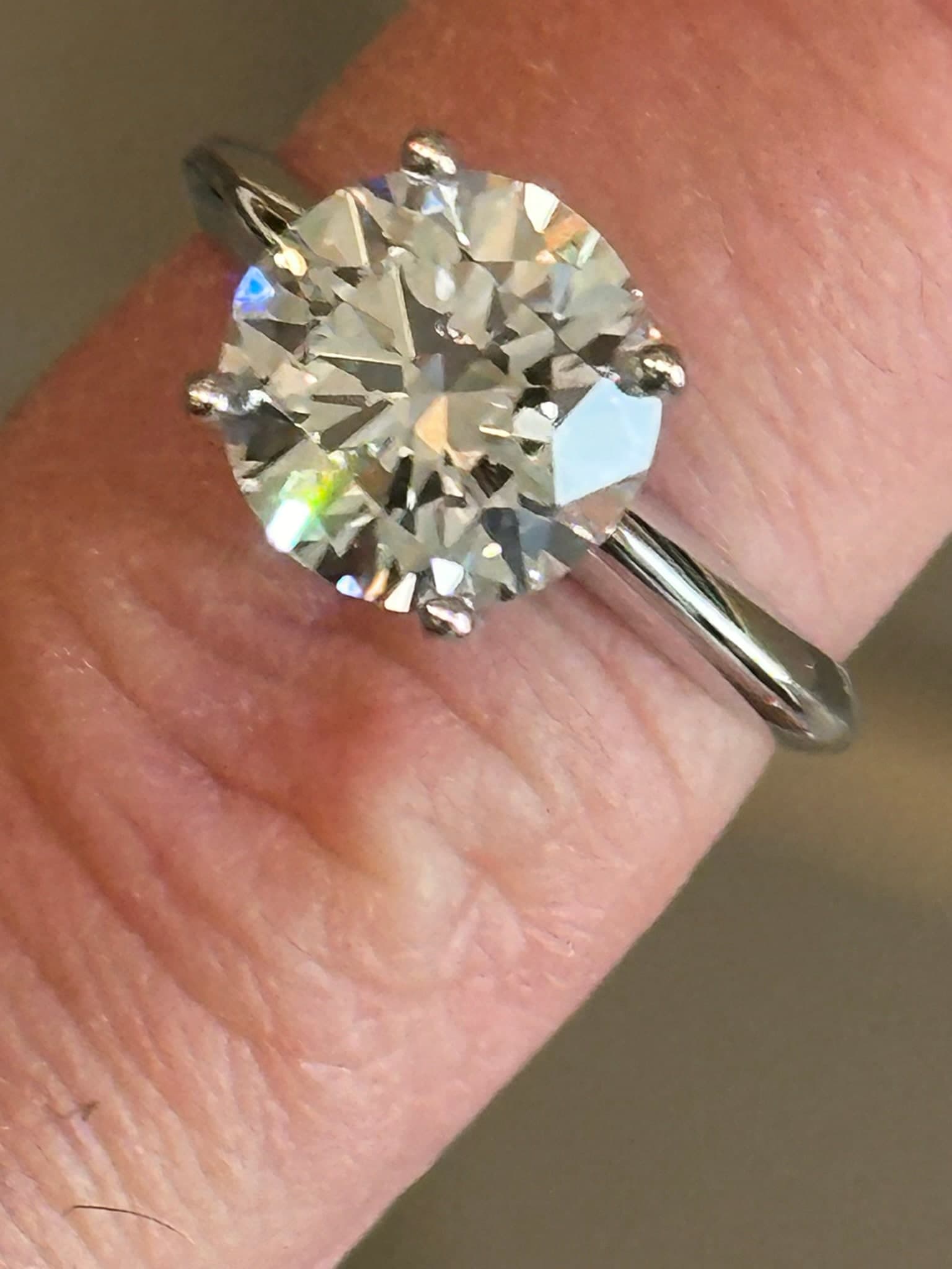 Classic round brilliant solitaire on a finger