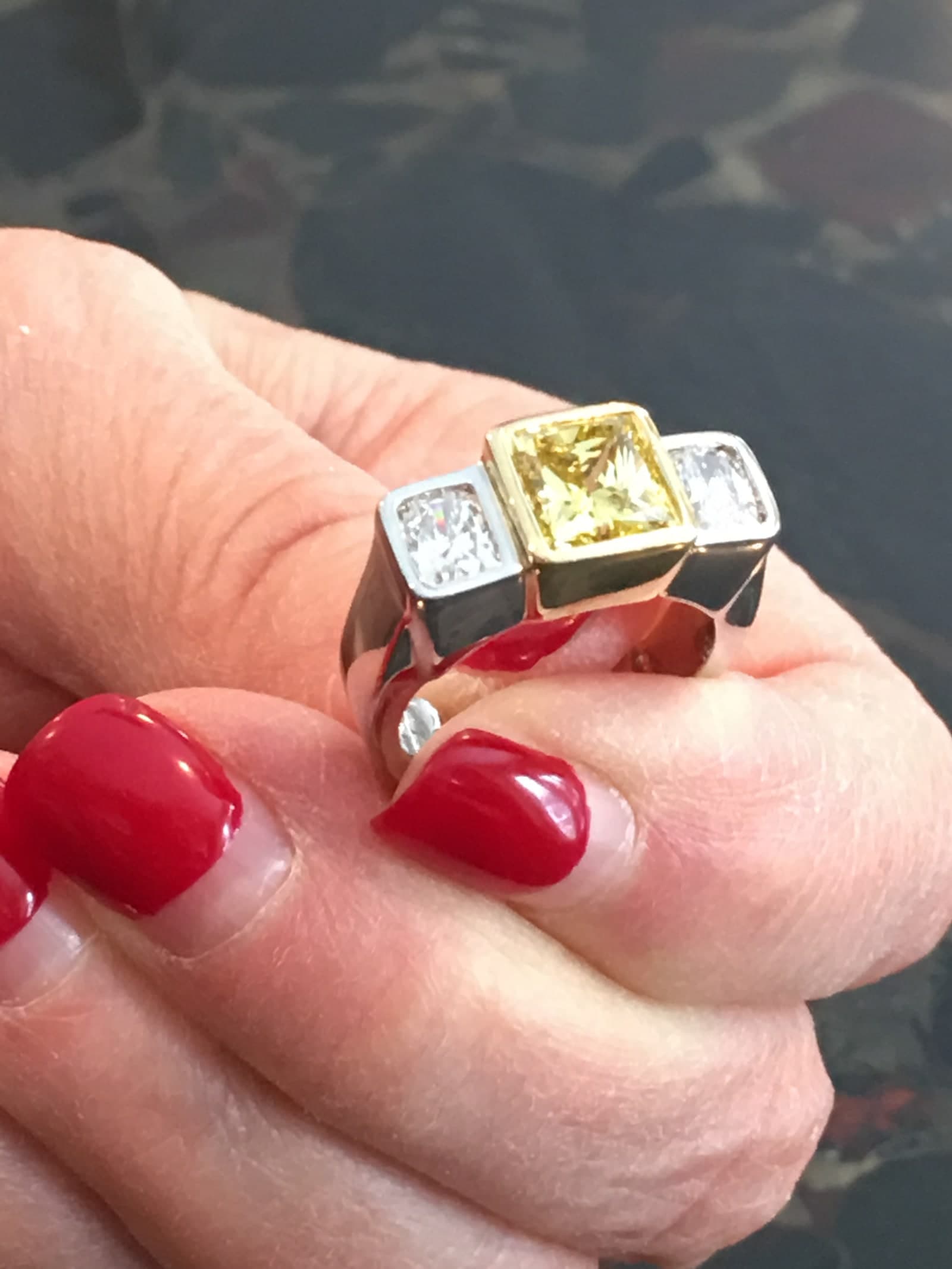 Yellow diamond three-stone ring in two-tone setting